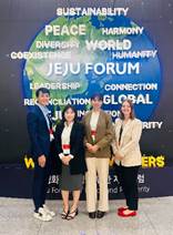 A group of people standing in front of a sign

AI-generated content may be incorrect.