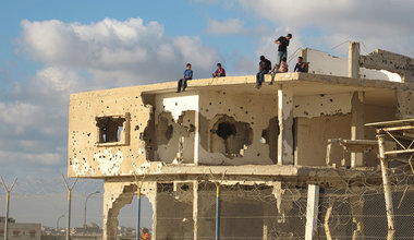 A group of youngsters sit on an abandoned building in Gaza. UN Photo/Shareef Sarhan