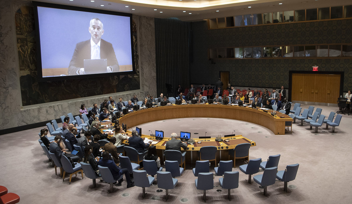 A wide view of the Security Council as Nickolay Mladenov (on screens), Special Coordinator for the Middle East Peace Process, briefs the Council on the situation in the Middle East, including the Palestinian question. (27 August 2019 - UN Photo/Eskinder Debebe)